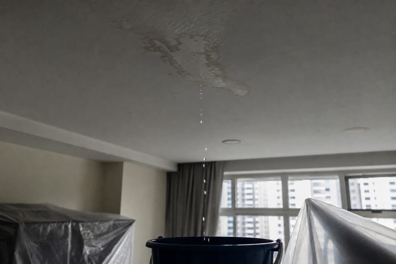 Emergency leak containment in a Singapore home ceiling