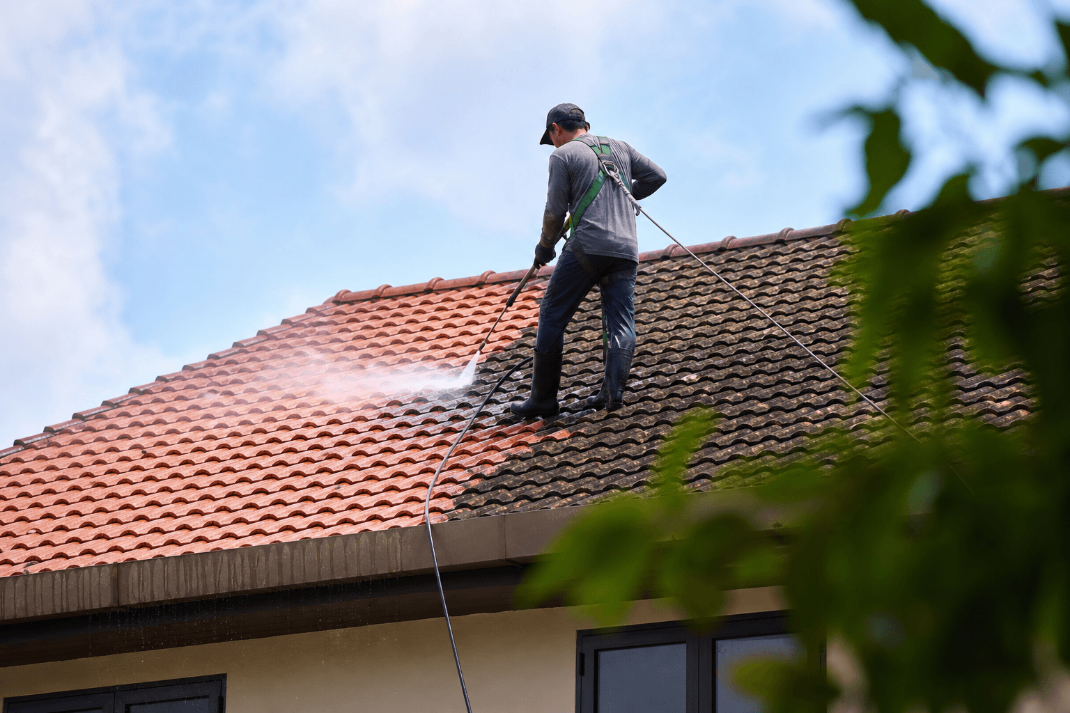 Roof tile cleaning and pressure washing on a Singapore landed house