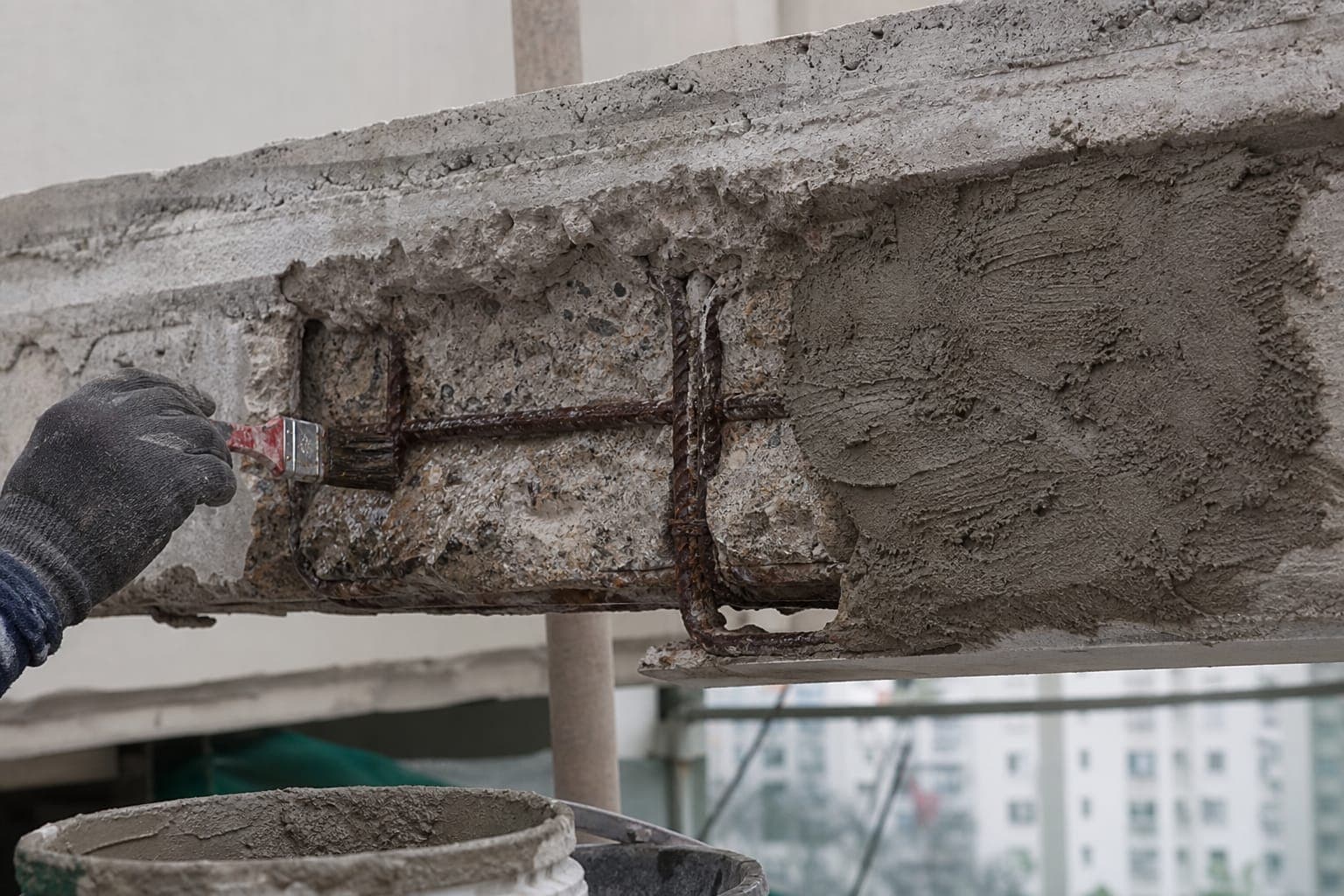 Structural rectification works on a concrete beam in Singapore