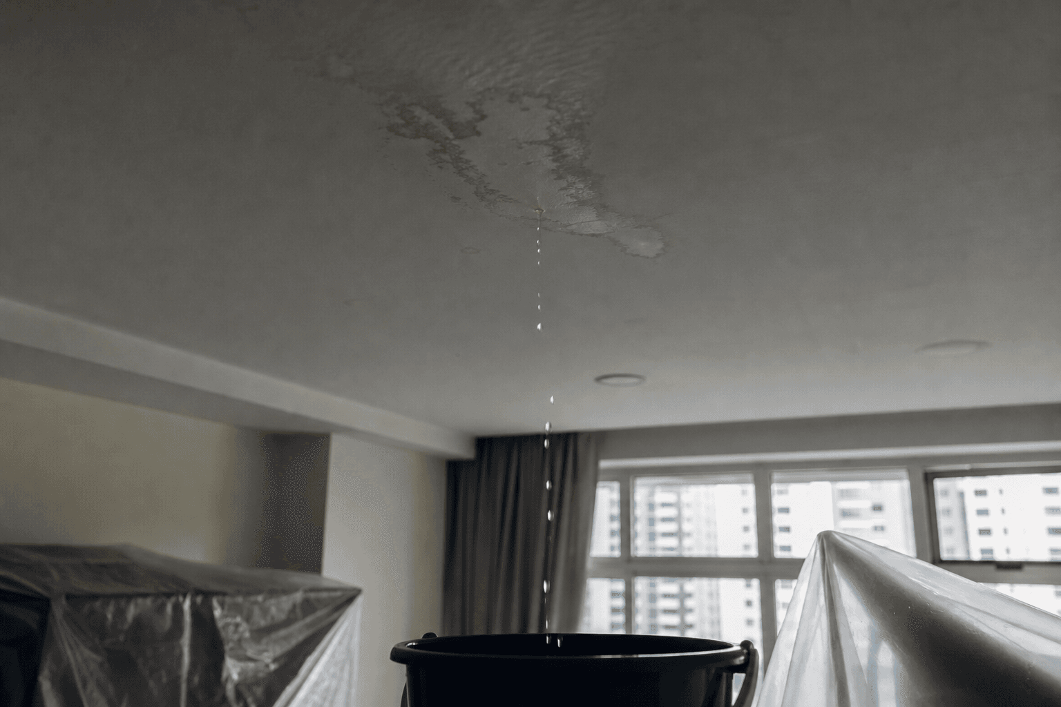 Emergency leak containment in a Singapore home ceiling