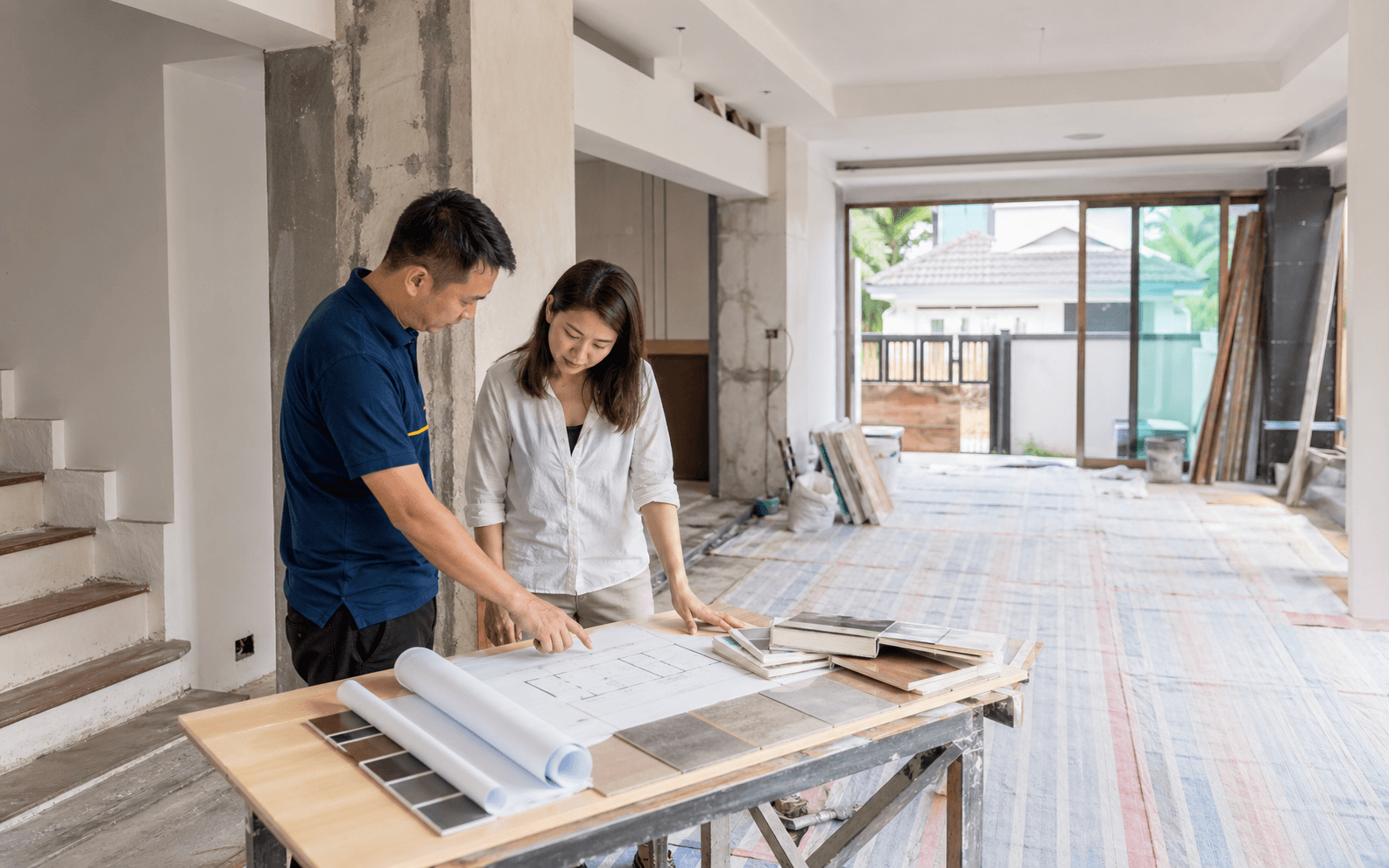 Landed renovation planning with a contractor and homeowner