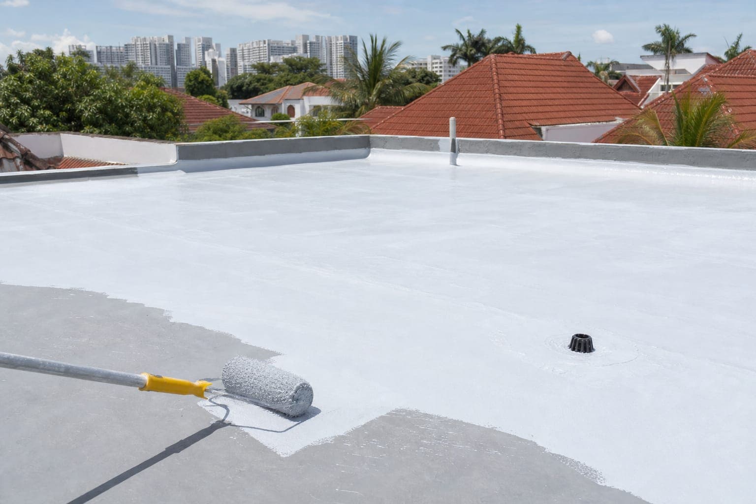 Roof waterproofing coating being applied on a Singapore landed house